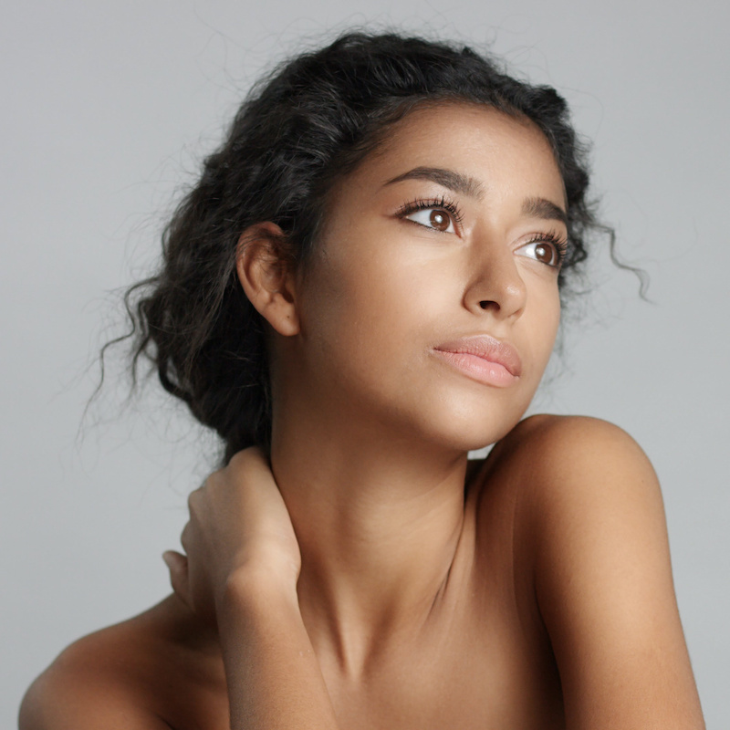 beautiful young woman with youthful face and neck