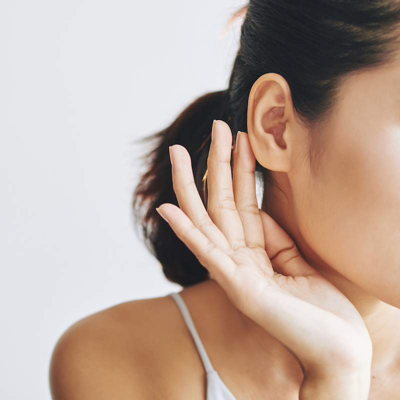 close up of womans ear