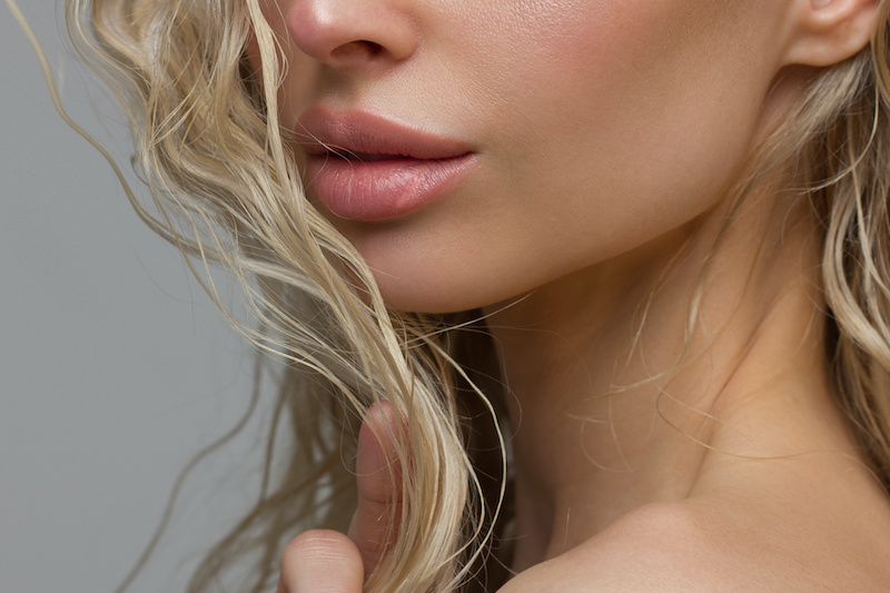close up of young womans neck and mouth